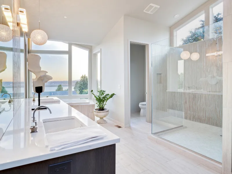 Tub-to-shower conversion in Cornelius, NC, showing the finished tile shower and glass door where a bathtub once stood