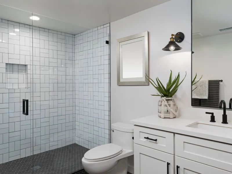 Custom walk-in shower conversion in Cornelius, NC, with curbless entry, floor-to-ceiling tile, and frameless glass door